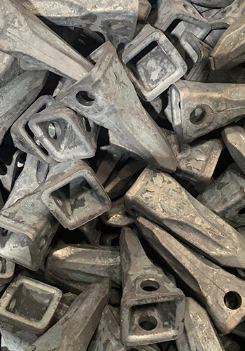 Brise-roche pour godet d'excavatrice